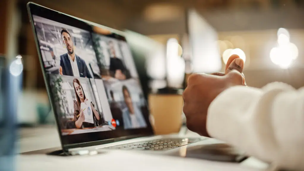 Multiethnic People Conference Meeting Online and Discussing Business