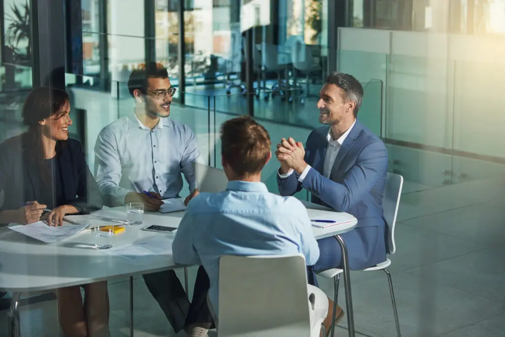 Business people, meeting and discussion for corporate planning, strategy or brainstorming at the office. Group of employee workers in business meeting, team planning or collaboration at the workplace